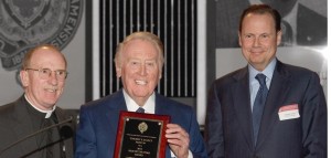 In January 2014, Nuñez (right) hosted a Fordham event on the set of Entertainment Tonight. He and Joseph M. McShane, SJ, president of Fordham (left), honored Vin Scully with the Ram of the Year award.