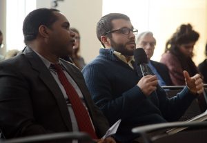 A student asks the panelists a question. To his left is a representative from the Cuba Mission to the United Nations, who attended the Feb. 26 panel. Photo by Joanna Mercuri