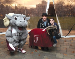 Top: “Buster” from the Dawn Animal Agency surveys his approving public.  Above: Students pose with “Buster” and Fordham's costumed mascot. Photos by Bruce Gilbert
