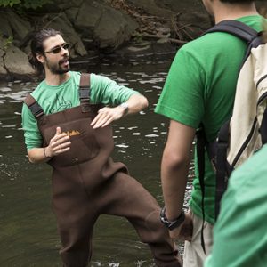 Grad student Corey Anko explains eel migration in the Bronx River. 