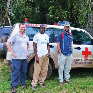 Epidemiologist Joseph Woodring, DO, FCRH '98 (left), in Liberia last year.