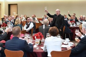Father McShane delivers a toast in the student center's new multi-purpose space. Photo by Dana Maxson 