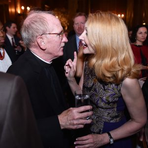 Father McShane and honoree Patricia Clarkson 