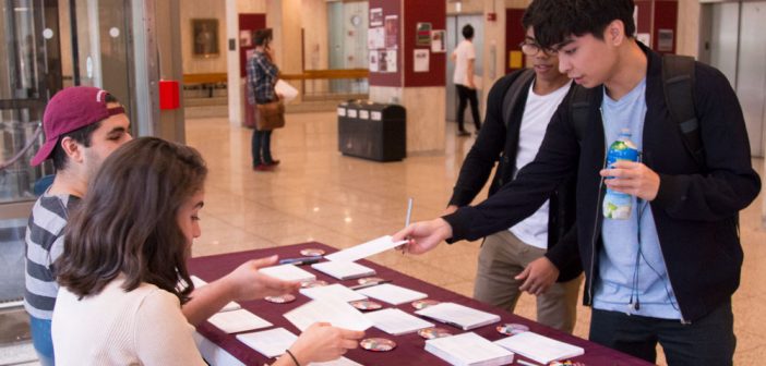 Students participate in a collaborative effort on campus to collect signed postcards in support of the DREAM Act, to send to U.S. congressmen in Washington D.C.