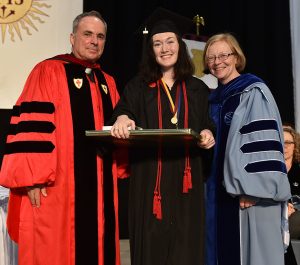 Claver Award winner Meghan Townsend, with , Thomas Scirghi, SJ, left, and Maura Mast, right