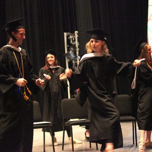 Graduates celebrate at the conclusion of the ceremony. 