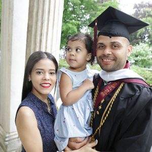 Graduate Manny Linares with his wife and daughter