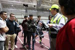 Kevin Meenan shows Gabelli School students a DJI Inspire 2 drone before demonstrating how it flies.