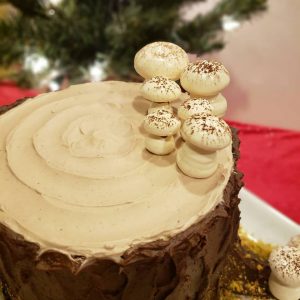 A Yule stump chocolate sponge cake that Tina baked for her Fordham colleagues last Christmas. The cake is filled with white chocolate mousse, covered with chocolate buttercream, and garnished with meringue mushrooms. 