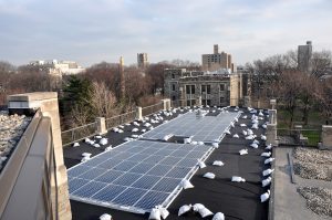 solar panels being installed on the roof of the Walsh Library in 2009