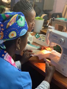 Women work at a sewing machine