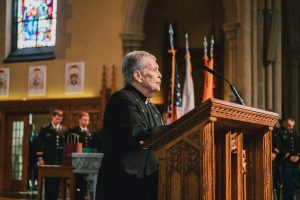 Father Sullivan at pulpit