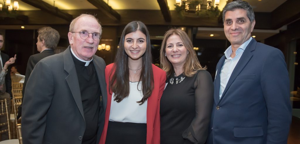 Fr. McShane with Founder's Scholar Kristen Harb and her parents Rula and Simon Harb