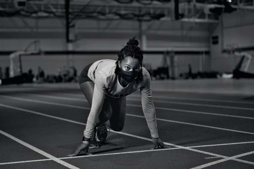 A girl lines up to run before track