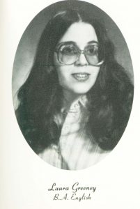 A black and white yearbook photo of a woman wearing glasses
