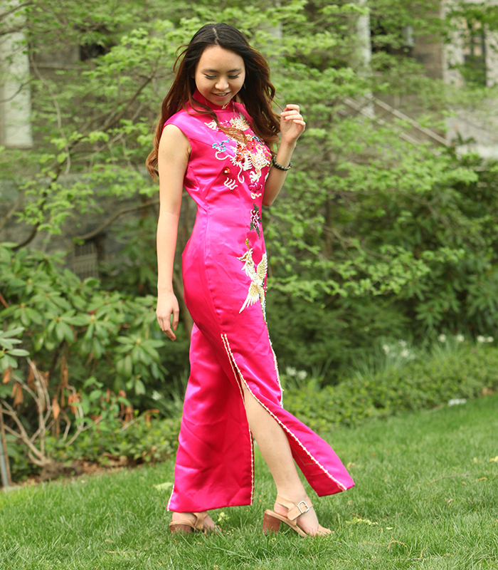 Angela Ly wears her mother's wedding dress, a traditional qi pao in silk with an embroidered phoenix and dragon. 
