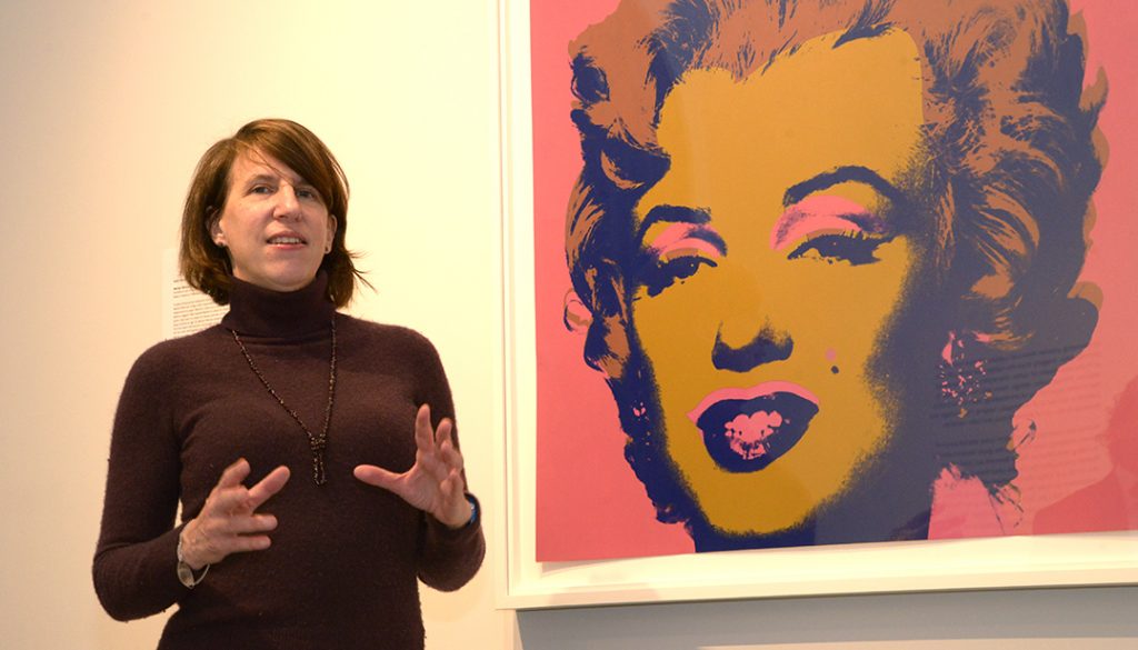 Dean Laura Auricchio discusses one of Warhol's iconic "Marilyn" painting at the National Arts Club's exhibition, "Andy Warhol Portfolios: A Life in Pop | Works from the Bank of America Collection."
